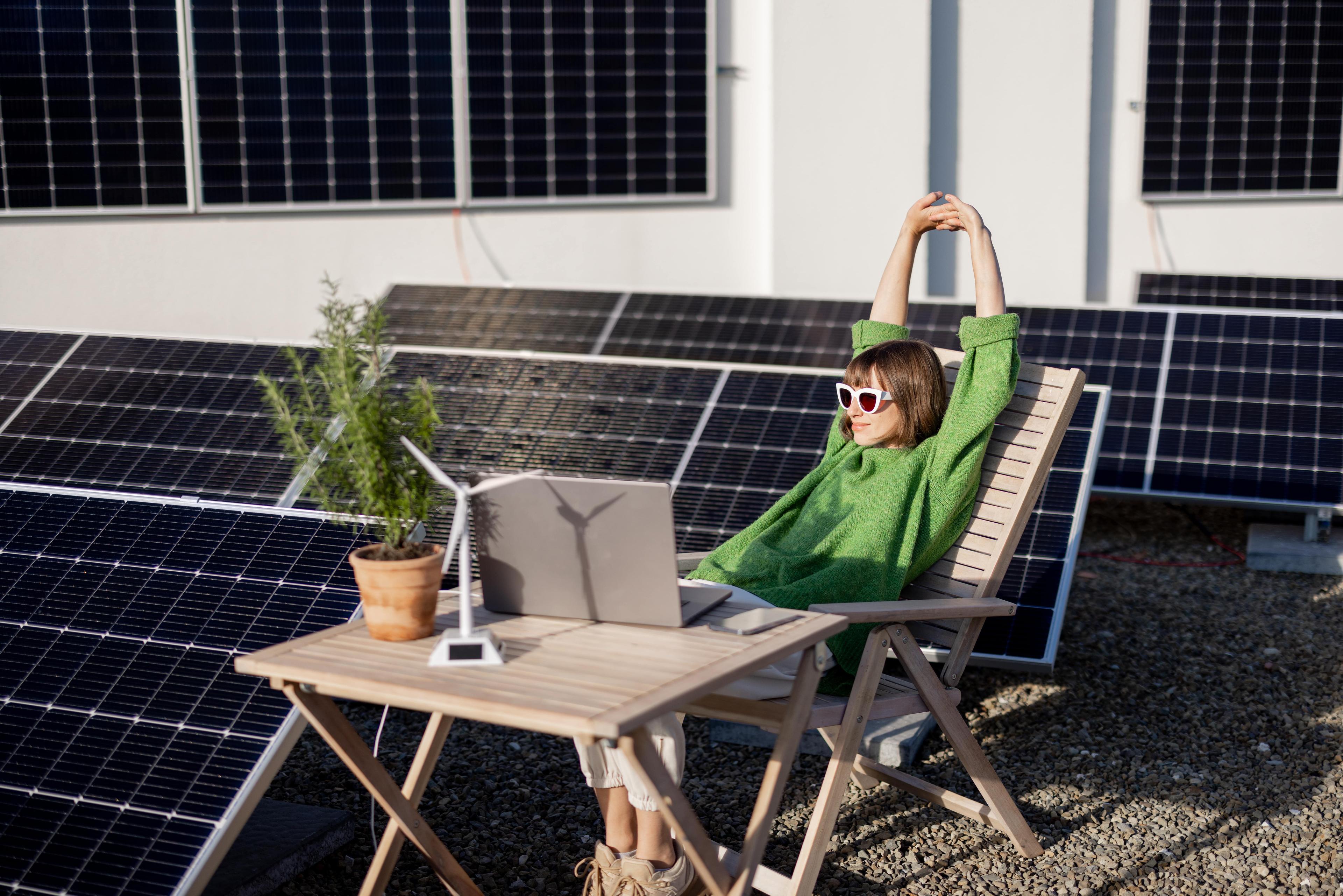 Woman using solarise on roof with solar panels
